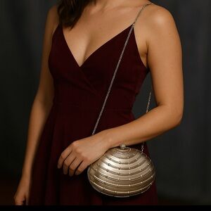 LA Regale silver clamshell evening bag